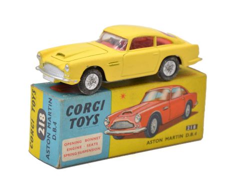 Corgi Toys die-cast model ref 218 Aston Martin DB4, yellow body, ref seats, boxed. 