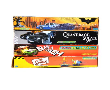 Mirco Scalextrics slot car sets, four including 'Batman Begins' Batmobile vs Police car; 'Quantum of Solace' Aston Martin DBS