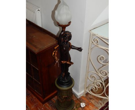 A 20th century torchere, modelled as a cherub holding a lamp, raised on a fluted column, H. 122cm.