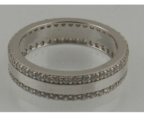 A silver and cubic zirconia set eternity ring. 