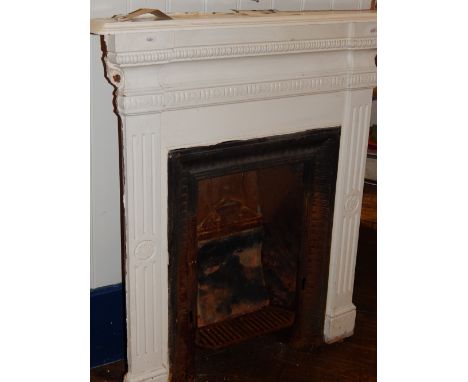 A late 19th century cast iron fire surround and grate, W. 94cm.