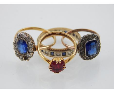 A sapphire and white stone full hoop eternity ring, together with three further dress rings, 8.5g. (4)