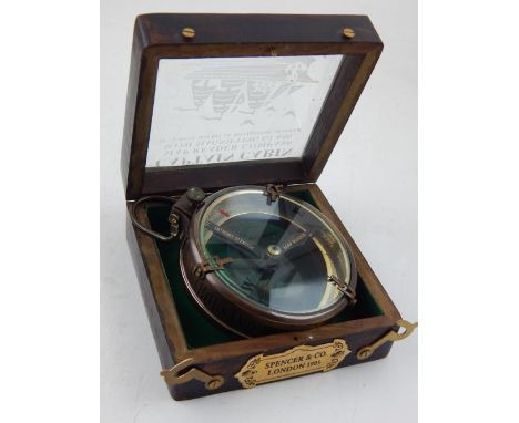 A boxed geographical map readers compass labelled Spencer & Co 1905.