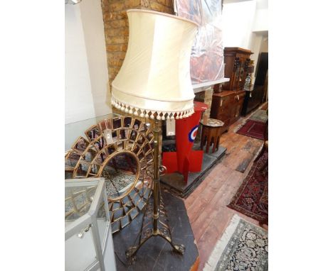 An early 20th century adjustable standard lamp, converted from an oil lamp. H. 154cm