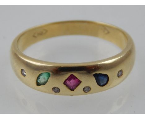 A yellow gold, diamond, ruby, sapphire and emerald ring, shank stamped 585.