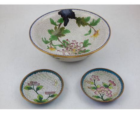 A Chinese cloisonne bowl, decorated with flowers on a cream scale ground, together with two cloisonne pin trays with similar 