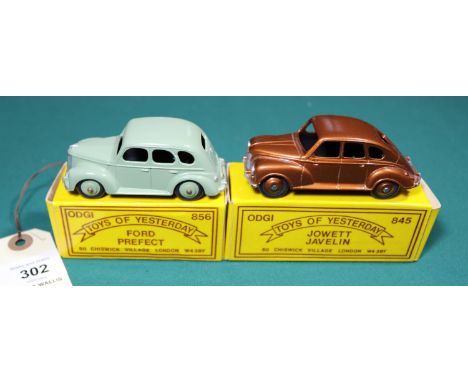 2 ODGI white metal toys. Jowett Javelin in bronze with bronze wheels. Together with a Ford Prefect in light green with light 