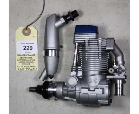 O.S. four stroke model aircraft engine for radio controlled aircraft. Model No. FS 81/34810, with silencer. Made in Japan 200