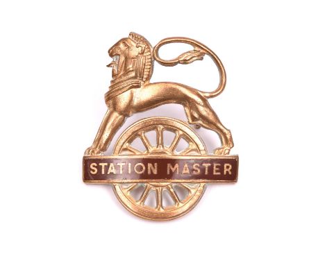 British Railways (Western Region) STATION MASTER cap badge. Brass and brown enamel lion over wheel, with 2 lugs to reserve. V