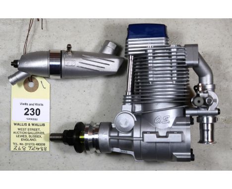 O.S. four stroke model aircraft engine for radio controlled aircraft. Model No. FS 81/34810, with silencer. Made in Japan 200