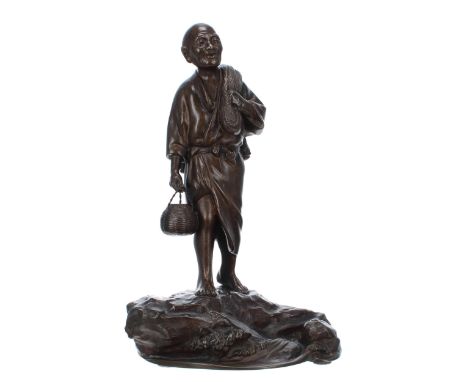 Good large Japanese bronze figure of a fisherman,&nbsp;carrying nets and a basket, modelled standing on a rocky naturalistic 