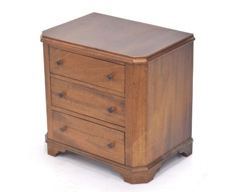 Apprentice mahogany chest of three graduated drawers, with canted corners, on bracket feet, 13" wide, 9" deep, 13" high 