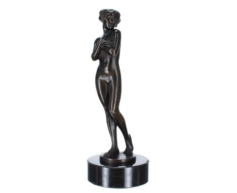 Art Deco figural bronze female nude, modelled standing mounted upon&nbsp;a circular marble socle, 11" high 