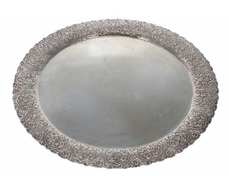 Large Greek white metal (900) circular serving tray,&nbsp;with a stylised arabesque embossed wide rim, maker 'M&amp;K' of Ath