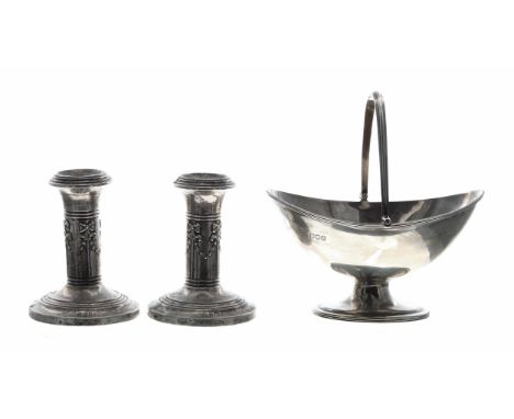 Pair of squat silver column candlesticks,&nbsp;repoussé decorated with bow and swag motif, maker W.J Myatt &amp; Co. Birmingh