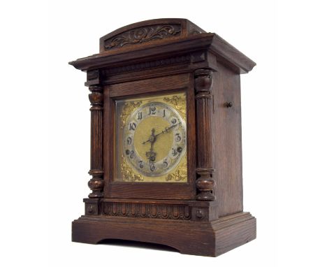 German oak cased three train mantel clock, the Kienzle movement no. 46929 striking on five rods, the 6.25" square brass dial 