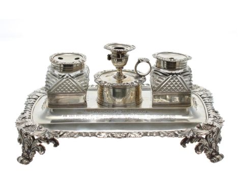 Fine George IV cast silver standish, complete with small chamber stick (lacking snuffer) and two silver mounted cut glass cru
