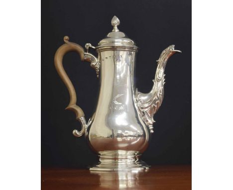 George III silver pear shaped coffee pot,&nbsp;with a fruitwood handle and hinged cover and a spiral fluted finial, acanthus 