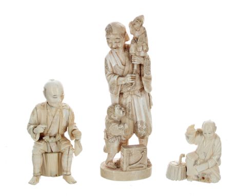 Japanese ivory okimono to include a&nbsp;puppet master, modelled with a child by his feet, flowerhead mark and signature to t