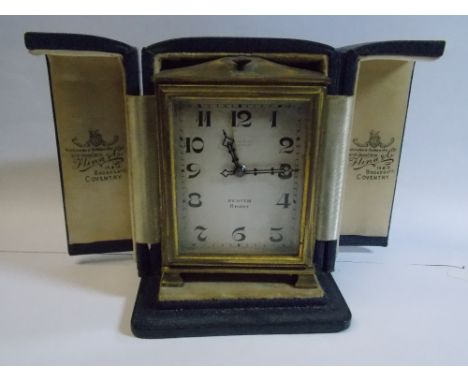 ZENITH EIGHT DAY TRAVELLING ALARM CLOCK IN LEATHER CASE RETAILED BY FLINN & CO, COVENTRY