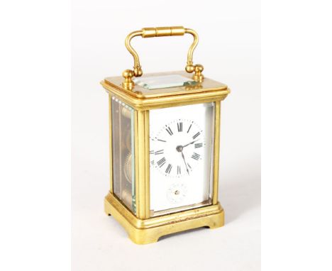 A MINIATURE FRENCH BRASS ALARM CARRIAGE CLOCK. 3ins high, in a leather carrying case.
