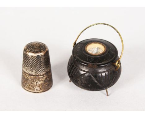A MINIATURE CAULDRON COMPASS and A VICTORIAN THIMBLE (2).