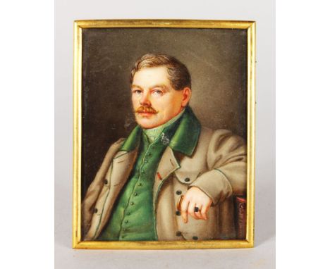 A HALF LENGTH PORTRAIT OF FURST HOHENLOCHE, wearing a thick coat and in a sitting pose. Signed.  9cms x 7cms, on porcelain in
