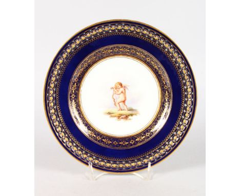 A MEISSEN PLATE WITH COBALT BLUE GROUND AND OPENWORK BORDER, circa 1860, decorated with intricate patterns of gilding, the ce