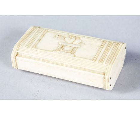 A NAPOLEONIC BONE PRISONER OF WAR RECTANGULAR SNUFF BOX, the lid with two hearts on a column. 8cms long.