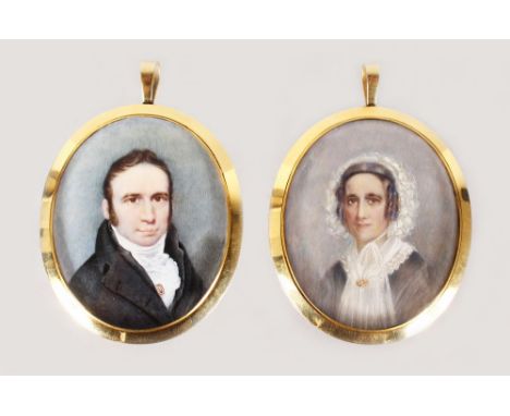 A SUPERB PAIR OF VICTORIAN OVAL PORTRAIT MINIATURES of a man in dark coat and cravat, a woman in a lace bonnet, both in gold 