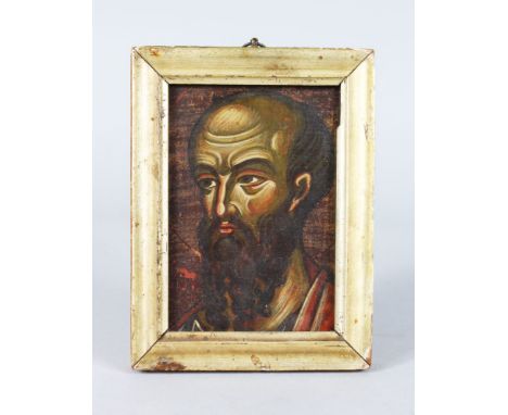 A RUSSIAN ORTHODOX HEAD OF A SAINT, on panel 5ins x 3ins, in a gilt frame.