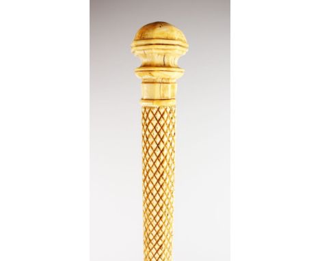A 19TH CENTURY WHALE BONE STICK. 31ins long.