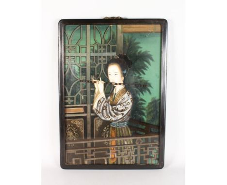 A 19TH CENTURY CHINESE REVERSE GLASS PAINTING depicting a lady playing a flute. Framed 26ins x 17ins.