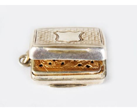 A MINIATURE VICTORIAN ENGINE TURNED VINAIGRETTE. 2cms long.  Birmingham 1834.  Maker: Francis Clark.