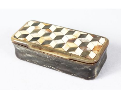 A LONG BONE SNUFF BOX, the lid with parquetry inlay. 8cms long.