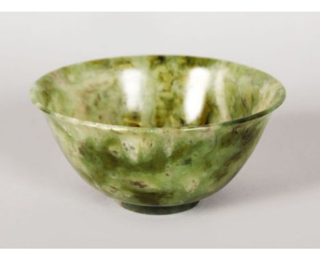 A SMALL JADE CIRCULAR BOWL.  4ins diameter.