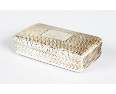 A GEORGE IV ENGINE TURNED RIBBED RECTANGULAR SNUFF BOX, 7cms long.  Birmingham 1827.  Maker: Nathaniel Mills.