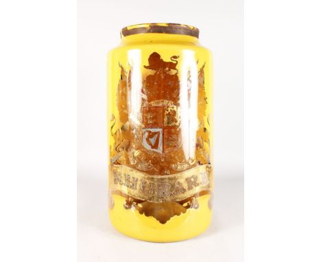 A VERY LARGE YELLOW PAINTED GLASS DRUG JAR with coat of arms and RHUBARB. 24ins high.