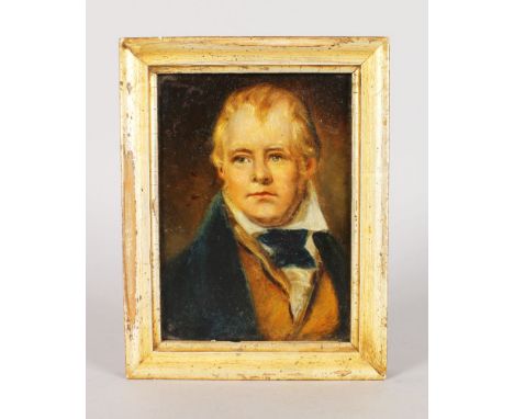 AN EARLY 19TH CENTURY HALF LENGTH PORTRAIT MINIATURE OF A MAN wearing a dark coat, oil on panel. 15cms x 10cms, in a wooden f