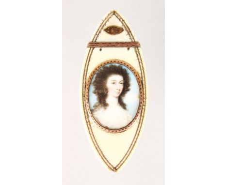 A GOOD GEORGE III IVORY PATCH BOX, the lid with a portrait of a lady, the inside with mirror and velvet. 10cms long.