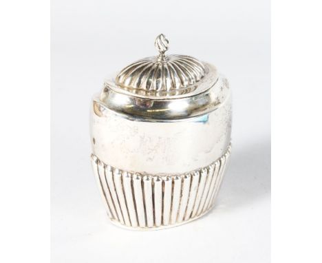 A VICTORIAN OVAL SEMI FLUTED TEA CADDY with hinged lid. London 1900.
