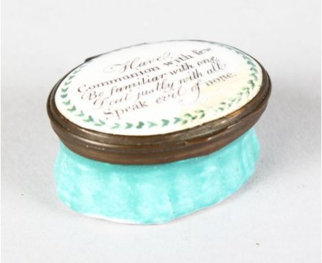 A BILSTON ENAMEL OVAL PATCH BOX, the lid "Have Communion With Few ............................. Speak Evil of None". 4.5cms l