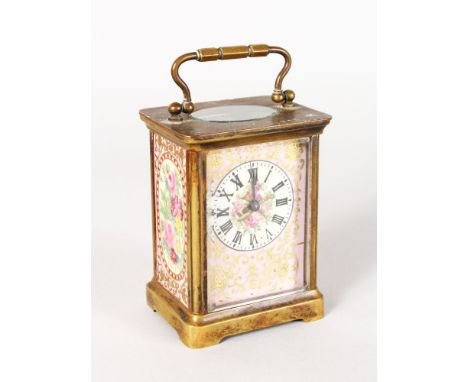 A SEVRES DESIGN BRASS AND PINK PORCELAIN CARRIAGE CLOCK with painted floral panels. 4.5ins high.