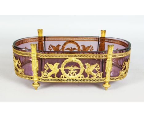 A GOOD 19TH CENTURY FRENCH ORMOLU PLANTER with glass liner and classical mounts. 11.5ins long.