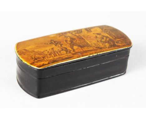 A LONG BONE SNUFF BOX, the lid with a shepherd and sheep outside a cottage. 9.5cms long.