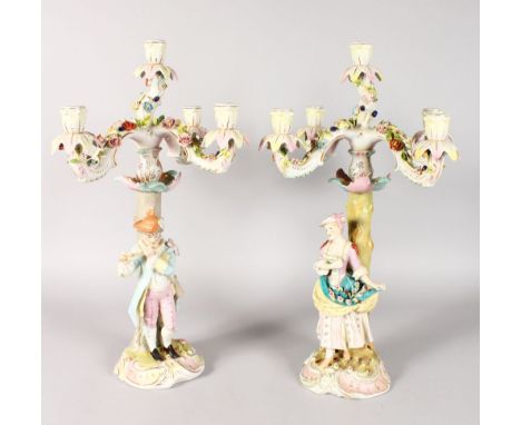 A GOOD LARGE PAIR OF DRESDEN STYLE FIVE LIGHT CANDELABRA with scrolling branches, the bases with a young boy playing a flute 