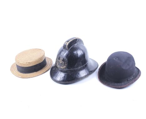 A group of three assorted vintage hats. Including a 20th century Fire Brigade cork  helmet by Helmets Ltd with badge and leat