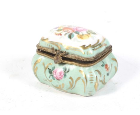 A late 19th/20th century rectangular trinket box and cover. Decorated with a hand painted flowers against a light green groun