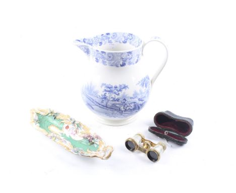 A large 19th century water jug, a porcelain tray and a pair of opera glasses. The blue and white jug transfer printed with a 