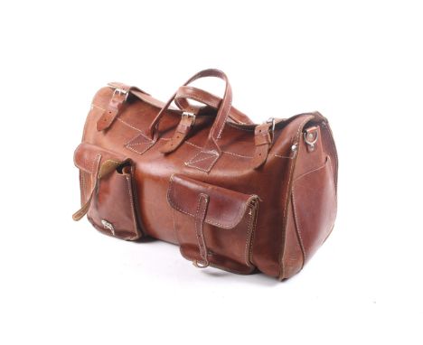 A vintage tan leather weekend holdall bag. With twin handles, two outer pockets with buckles, three buckles along the top. L4
